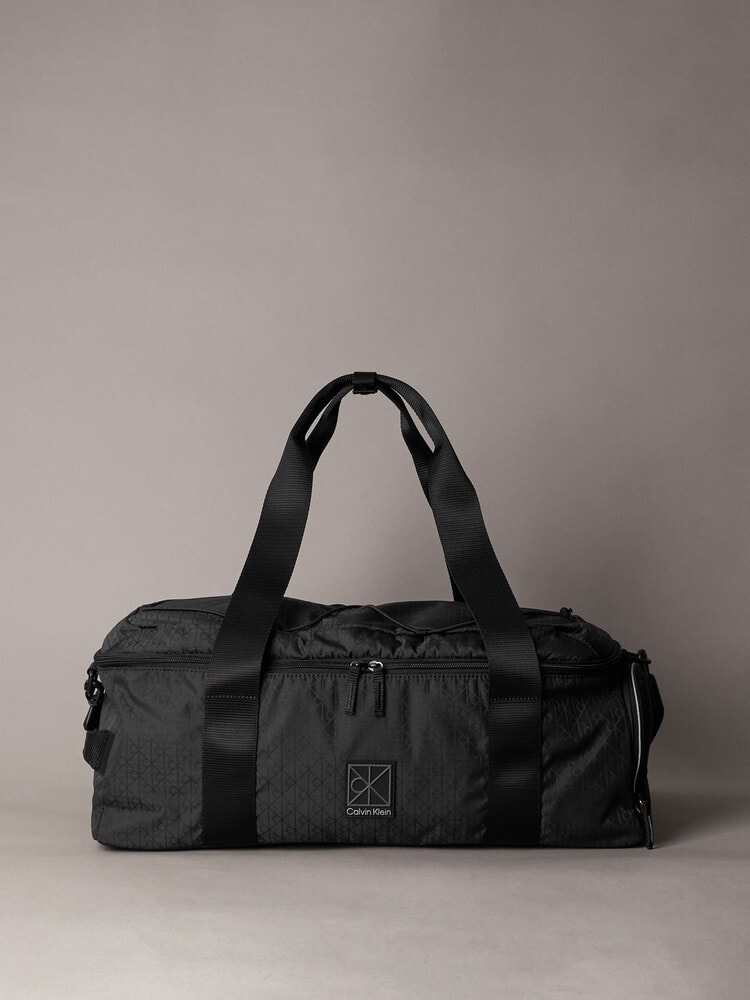【美品】Black&Whlte ダッフルバッグ バッグ - ユーティリティエンブレムダッフルバッグ | カルバン